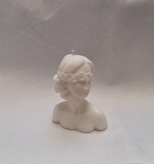 Handmade sculpted bust candle of a woman with flower blindfold, unique decorative soy wax candle for gifts or home decor.