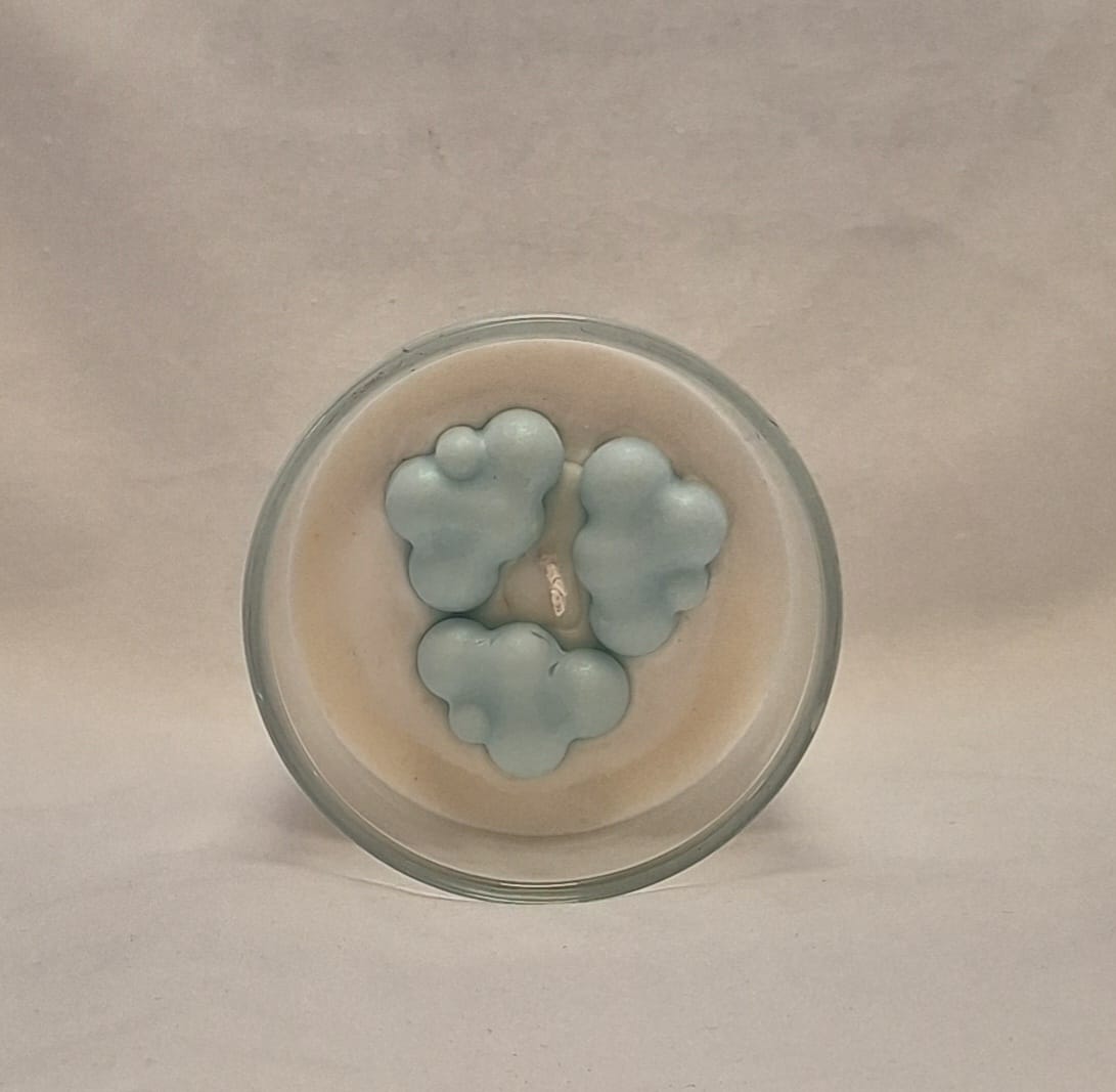 Unboxed Cloud 9 soy wax candle showing blue clouds top inside a clear glass container, 300g