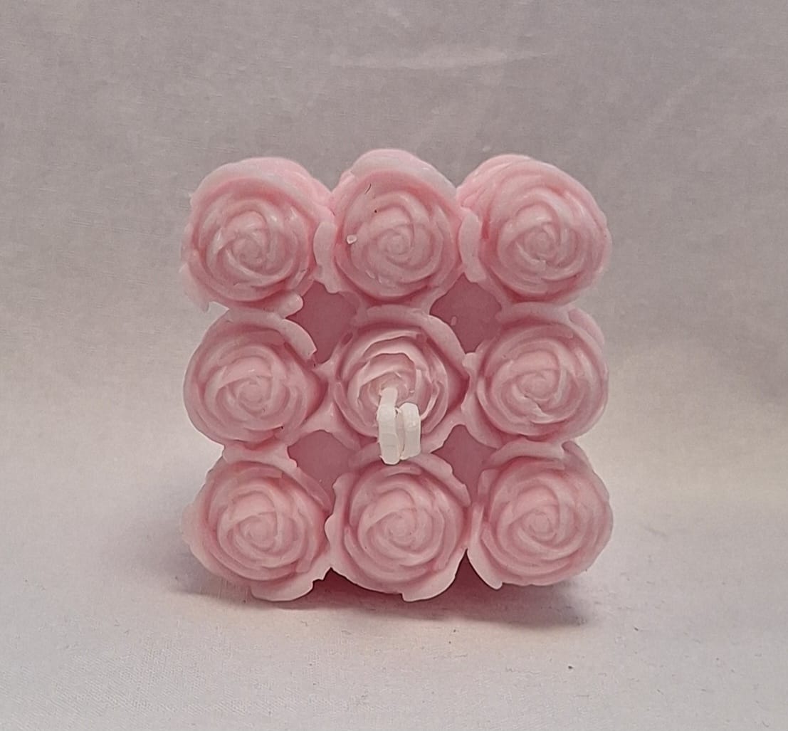 Pink handmade rose cube candle with sculpted floral detailing, ideal for romantic gifts or home décor.